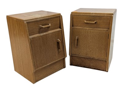Lot 883 - ERNEST GOMME FOR G-PLAN FURNITURE - PAIR OF OAK BEDSIDE CABINETS