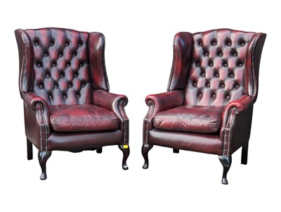 Lot 1056 - PAIR OF OXBLOOD LEATHER BUTTON BACK QUEEN ANNE WING BACK ARMCHAIRS