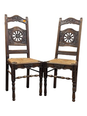 Lot 1113 - PAIR OF 19TH CENTURY FRENCH OAK BRETONNES CARVED RUSH DINING CHAIRS