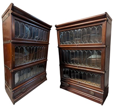 Lot 562 - PAIR OF EARLY 20TH CENTURY THREE-TIER STACKING BOOKCASE CABINETS