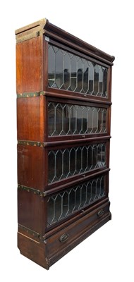 Lot 560 - EARLY 20TH CENTURY OAK FOUR-TIER STACKING BOOKCASE CABINET