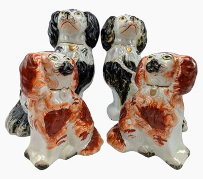Lot 125 - FOUR STAFFORDSHIRE POTTERY 19TH CENTURY SPANIEL DOG FIGURES