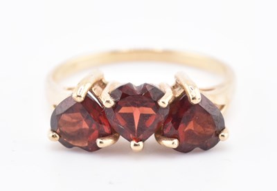 Lot 447 - HALLMARKED 9CT GOLD MOZAMBIQUE GARNET THREE STONE RING