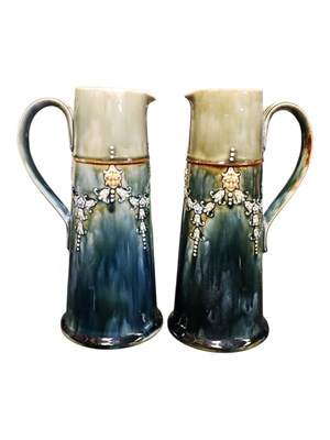 Lot 9 - A PAIR OF EARLY 20TH CENTURY ROYAL DOULTON LAMBETH JUG EWERS