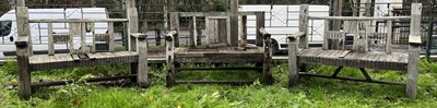 Lot 619 - THREE WOODEN DRIFTWOOD-EFFECT PUB GARDEN OUTDOOR BENCHES