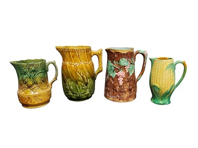Lot 116 - FOUR 19TH CENTURY VICTORIAN MAJOLICA PITCHERS / JUGS