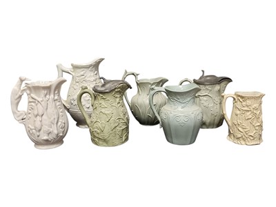 Lot 117 - COLLECTION OF SEVEN 19TH CENTURY RELIEF MOULDED CERAMIC JUGS