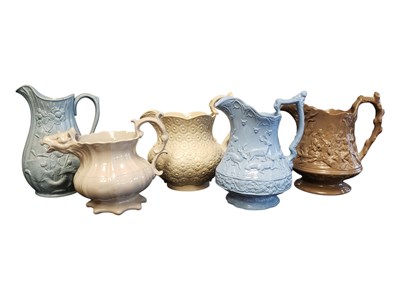 Lot 130 - FIVE 19TH CENTURY VICTORIAN DRABWARE RELIEF MOULDED JUGS