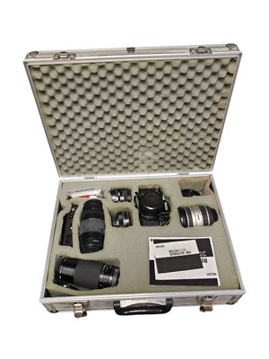 Lot 305 - 1980S RICOH XR 7 CAMERA AND VARIOUS LENSES HOUSED WITHIN A SILVERED BRIEFCASE