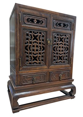 Lot 69 - HUANGHULI WOOD OPEN WORK TABLE CABINET 黄花梨双门桌柜