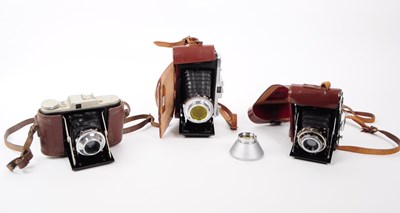 Lot 246 - THREE 20TH CENTURY FOLDING CAMERAS