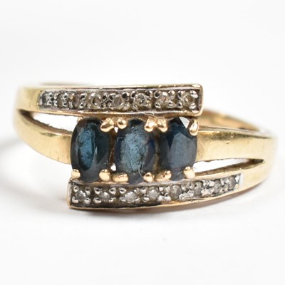 Lot 233 - HALLMARKED 9CT GOLD SAPPHIRE & DIAMOND CROSSOVER RING