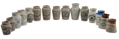 Lot 208 - VINTAGE ADVERTISING. COLLECTION OF 15 STONEWARE CREAM JUGS, NAMED