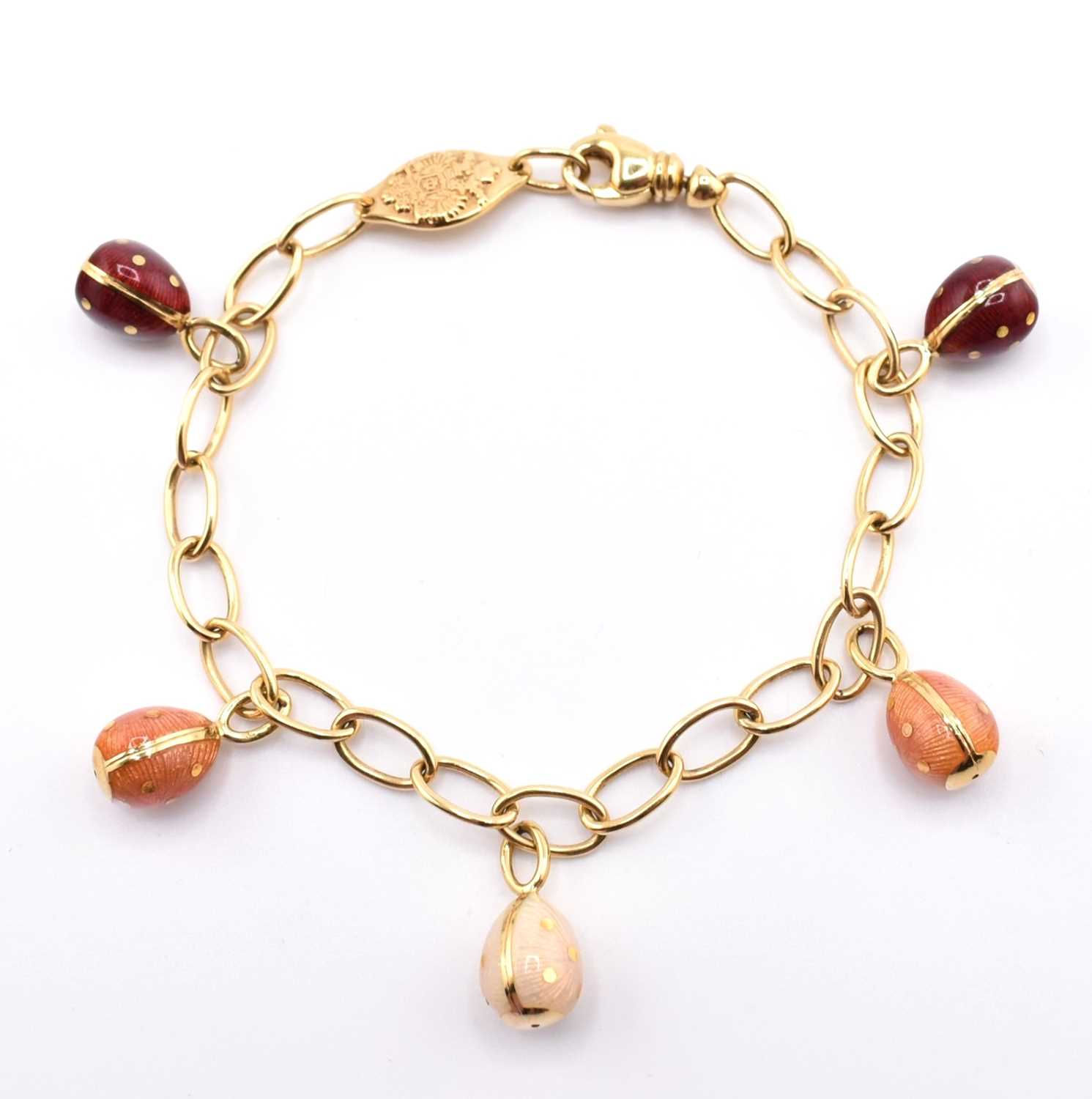 Lot 26 - FABERGÉ 18CT GOLD EGG CHARM BRACELET CASED