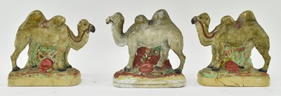 Lot 41 - THREE 19TH CENTURY STAFFORDSHIRE FLATBACK CERAMIC CAMELS