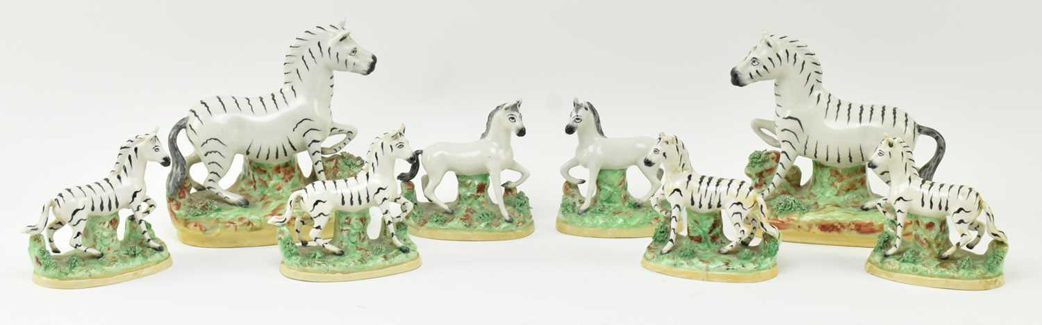 Lot 54 - EIGHT 19TH CENTURY STAFFORDSHIRE HAND PAINTED POTTERY ZEBRAS