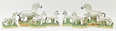 Lot 54 - EIGHT 19TH CENTURY STAFFORDSHIRE HAND PAINTED POTTERY ZEBRAS