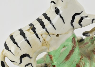 Lot 54 - EIGHT 19TH CENTURY STAFFORDSHIRE HAND PAINTED POTTERY ZEBRAS