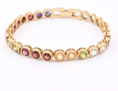 Lot 35 - 18CT GOLD GEM SET TENNIS BRACELET