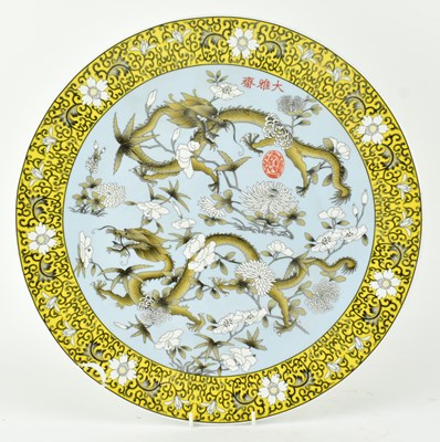 Lot 64 - QING DYNASTY POLYCHROME ENAMELLED PLATE 清 珐琅彩花穿龙纹盘