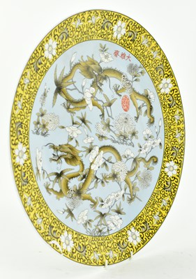 Lot 64 - QING DYNASTY POLYCHROME ENAMELLED PLATE 清 珐琅彩花穿龙纹盘