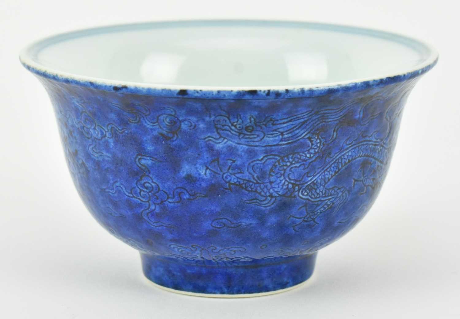 Lot 115 - BLUE GLAZED INCISED "LOTUS" TEA BOWL 永乐款 青花缠枝莲纹压手杯