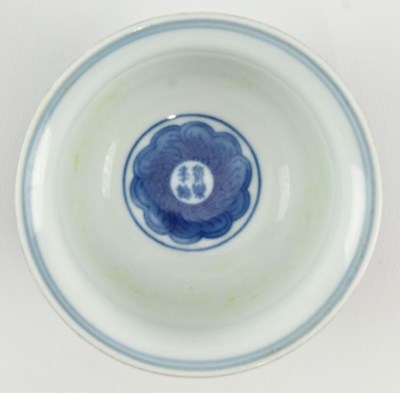 Lot 115 - BLUE GLAZED INCISED "LOTUS" TEA BOWL 永乐款 青花缠枝莲纹压手杯