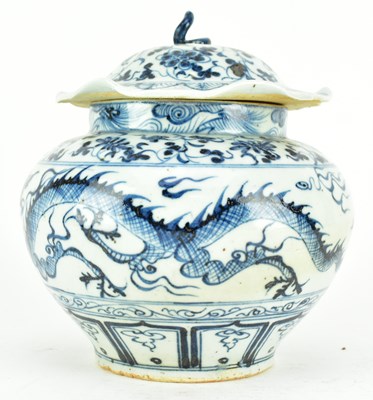 Lot 90 - BLUE AND WHITE "DOUBLE DRAGON" JAR WITH LID 元 青花云龙纹荷叶盖罐