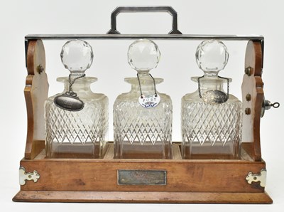 Lot 156 - 19TH CENTURY SILVER PLATED & OAK THREE CUT GLASS DECANTERS TANTULUS