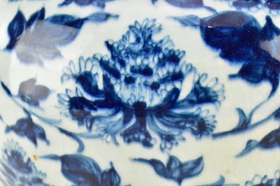 Lot 48 - MING BLUE AND WHITE 'PEONY' JAR 明 青花缠枝莲纹罐