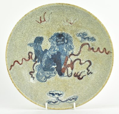 Lot 14 - QING GE-TYPE BLUE AND WHITE UNDERGLAZE RED CHARGER 清 哥窑青花釉里红狮子滚绣球盘