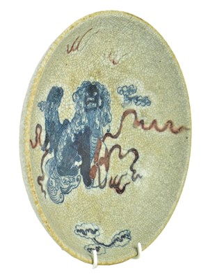 Lot 58 - QING GE-TYPE BLUE AND WHITE UNDERGLAZE RED CHARGER 清 哥窑青花釉里红狮子滚绣球盘