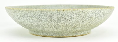 Lot 58 - QING GE-TYPE BLUE AND WHITE UNDERGLAZE RED CHARGER 清 哥窑青花釉里红狮子滚绣球盘