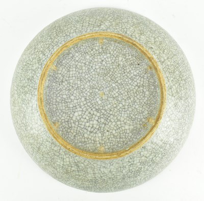 Lot 58 - QING GE-TYPE BLUE AND WHITE UNDERGLAZE RED CHARGER 清 哥窑青花釉里红狮子滚绣球盘