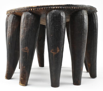 Lot 287 - NIGERIAN TRIBAL CARVED HARDWOOD NUPE STOOL WITH ELEVEN LEGS