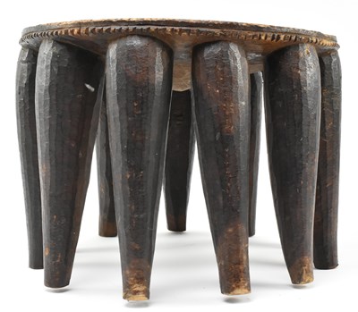 Lot 287 - NIGERIAN TRIBAL CARVED HARDWOOD NUPE STOOL WITH ELEVEN LEGS