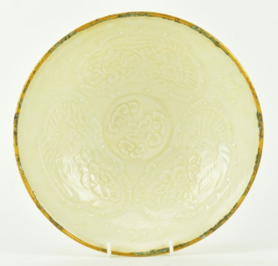 Lot 51 - NORTHERN SONG DYNASTY DINGYAO "DRAGON" PLATE 北宋定窑龙凤穿牡丹碗