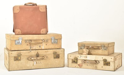 Lot 581 - FOUR EARLY 20TH CENTURY PAPER VELLUM TRAVELLING SUITCASES & A CASE