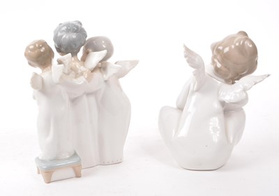 Lot 65 - LLADRO - TWO HAND MADE SPANISH PORCELAIN CHERUB FIGURINES