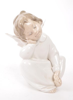 Lot 65 - LLADRO - TWO HAND MADE SPANISH PORCELAIN CHERUB FIGURINES