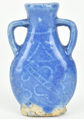 Lot 76 - TWO QING DYNASTY CERAMIC SNUFF BOTTLES 清 青花鼻烟壶和蓝釉鼻烟壶