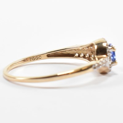 Lot 498 - HALLMARKED 9CT GOLD TANZANITE & WHITE STONE RING
