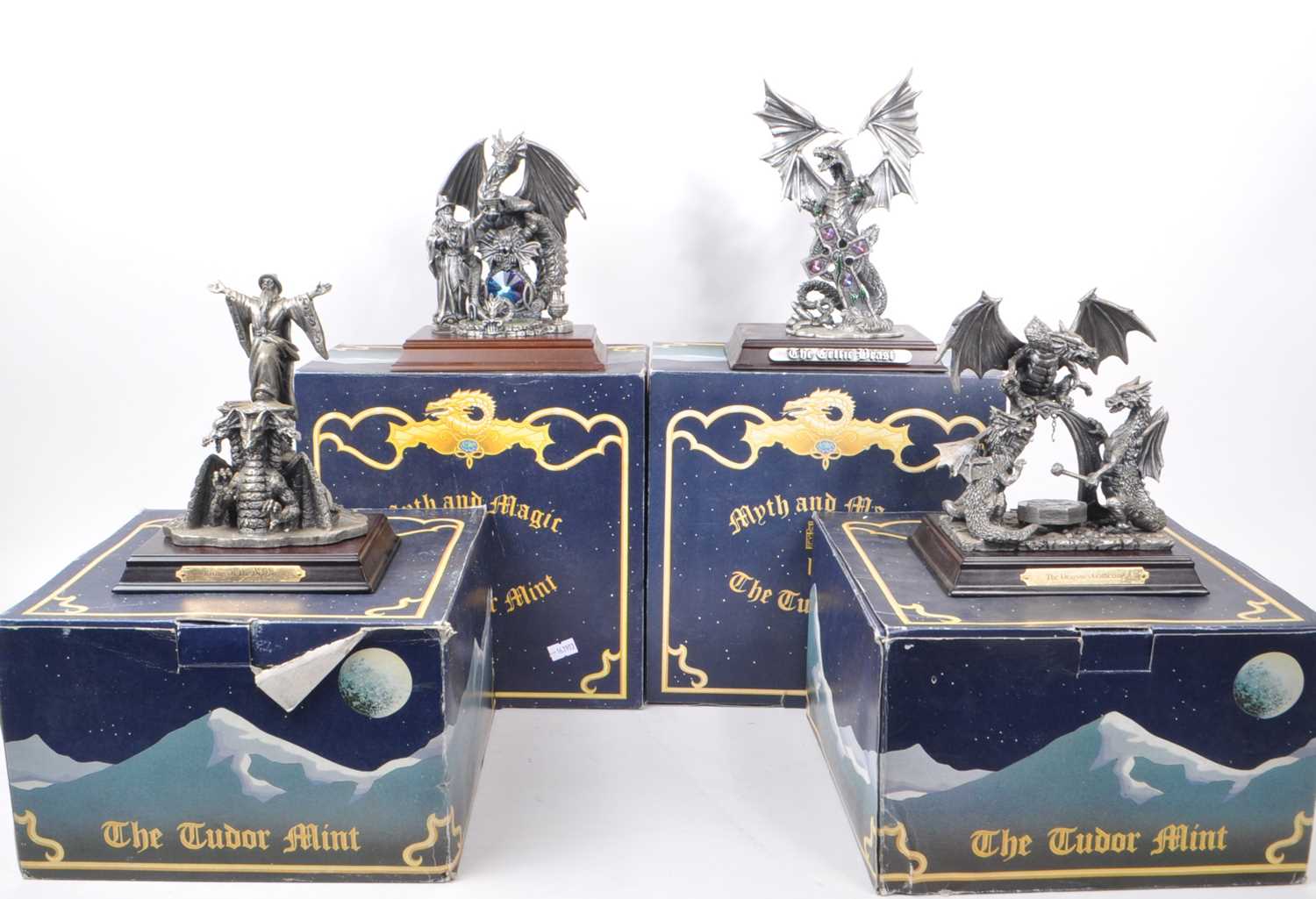 Lot 312 - MYTH & MAGIC BY THE TUDOR MINT - FOUR CAST PEWTER DRAGON FIGURES